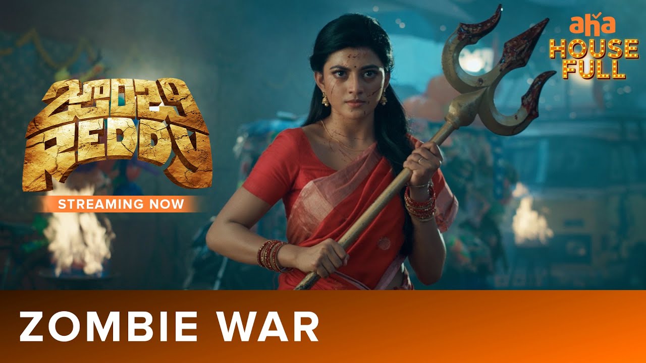 Zombie Reddy still of a woman in a red sari holding a trishul during the village zombie-war sequence